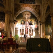 Lighting the altar candles  at the beginning of Adoration.