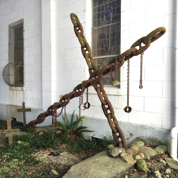 The Tomb of the Unknown Slave is located in the garden plot of Saint Augustine Church. This shrine, consisting of grave crosses, chains and shackles is dedicated to the memory of the nameless, faceless, turfless Africans who met an untimely death in Faubourg Treme.